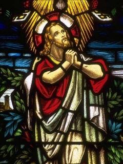 Stain glass window of Christ in the Garden of Gethsemane.